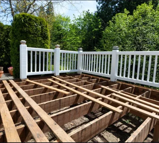 Deck framing repair in progress with white vinyl railing in Eugene, Oregon