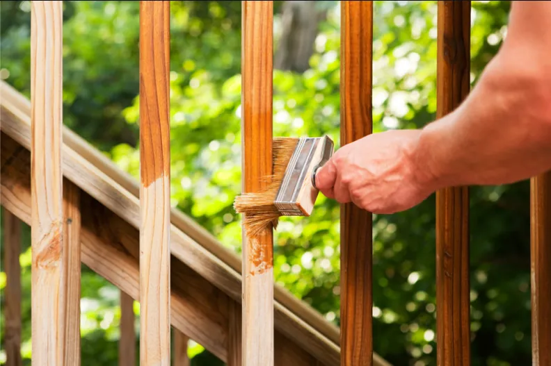 Deck railing being repaired and refinished