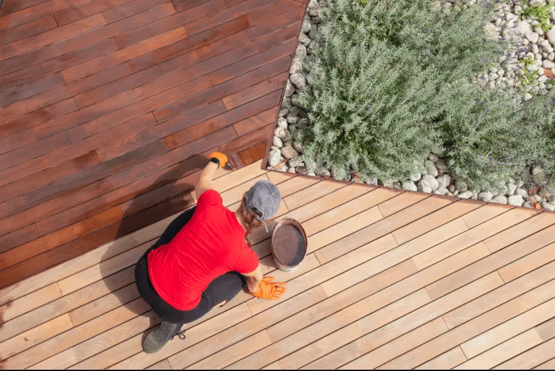 Deck sealer being applied to wood boards in Eugene, Oregon