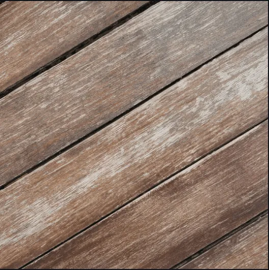 Faded, greyed wood deck boards that need sealing