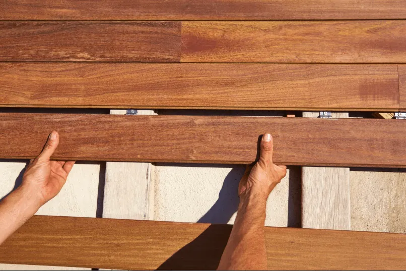 New composite deck boards installed during a deck resurfacing project